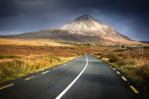 Ireland, Northern Ireland, Mount Errigal in the evening light, road through countryside Ireland, Northern Ireland, Mount Errigal in the evening light, road through countryside
